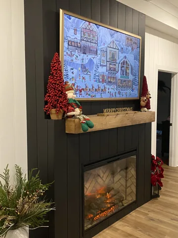 Dark vertical wall panels surround a fireplace with a wood mantel.